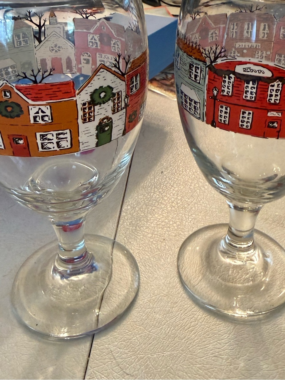 Pair of Christmas Holiday Village Scene Stemmed Drinking Glasses multi-colored